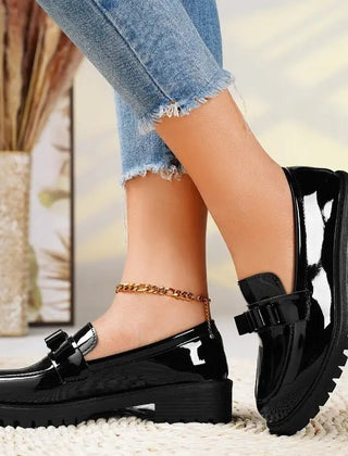 Patent bow loafers in Black with chunky lug sole
