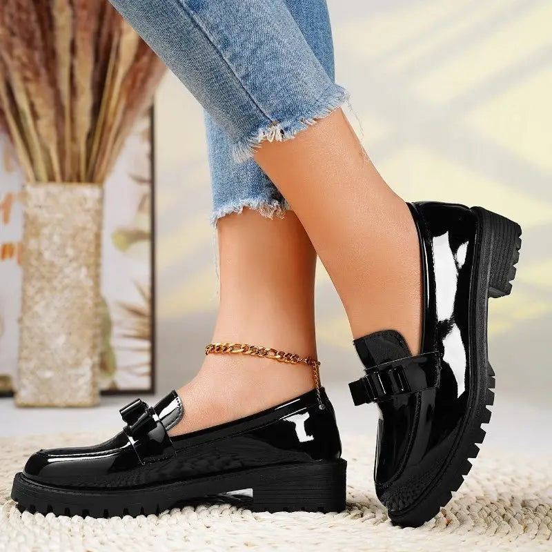 Patent bow loafers in Black with chunky lug sole