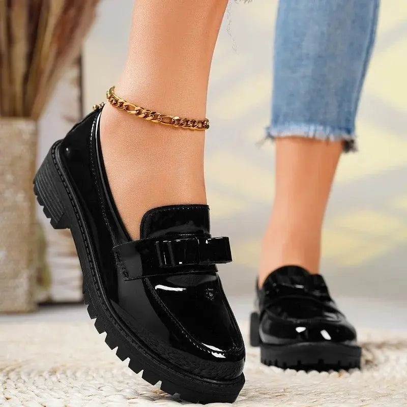 Patent bow loafers in Black, front view